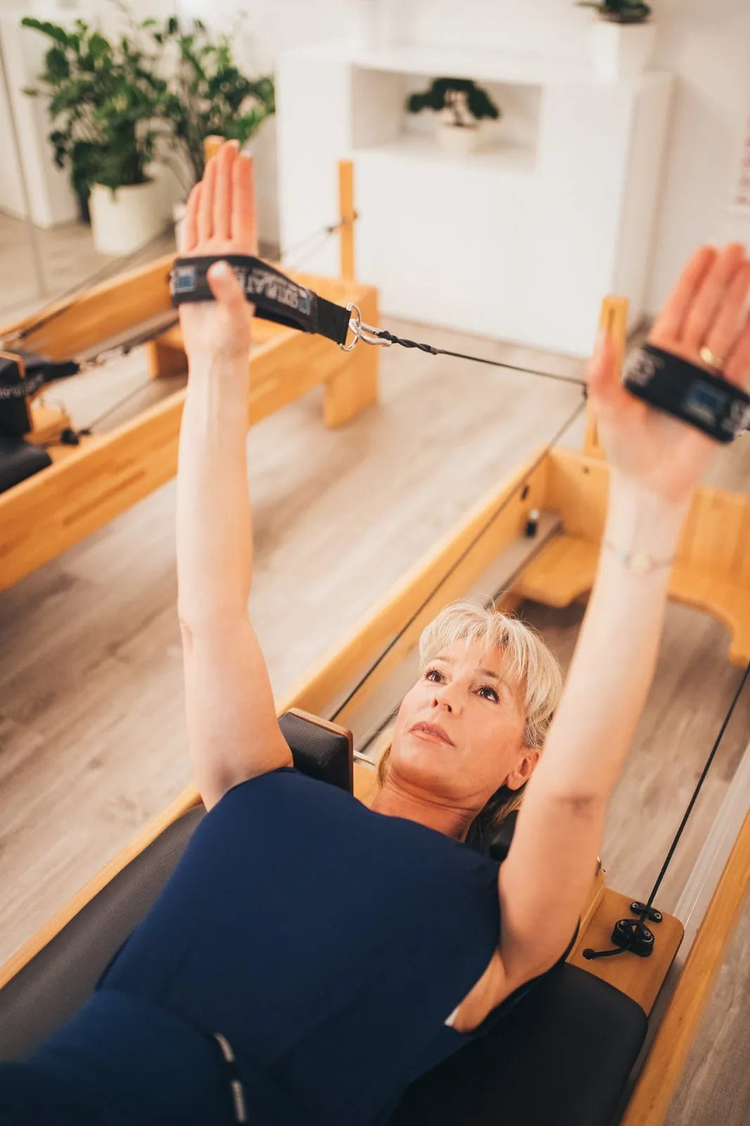 Séance sur reformer — extension des bras